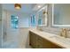 Stylish bathroom featuring double vanity, marble counters, and modern fixtures with natural light at 1552 Harborsun Dr, Charleston, SC 29412