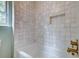 Updated bathroom featuring a soaking tub, a niche in the shower, and stylish tile at 1552 Harborsun Dr, Charleston, SC 29412