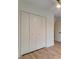 Bedroom with wood floors and a closet with an overhead light at 1552 Harborsun Dr, Charleston, SC 29412