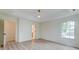 Spacious bedroom featuring hardwood floors, a ceiling fan, a view to a large closet, and ample natural light at 1552 Harborsun Dr, Charleston, SC 29412