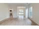 Bright, open living space with modern floors, a kitchen view, and a connected dining area at 1552 Harborsun Dr, Charleston, SC 29412