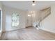 Bright and airy living room features sleek floors, a ceiling fan, and ample natural light at 1552 Harborsun Dr, Charleston, SC 29412