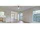 Bright living room leads to dining area and kitchen, enhanced by modern flooring at 1552 Harborsun Dr, Charleston, SC 29412