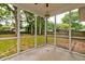 Relaxing screened porch with views of the backyard and mature trees, perfect for outdoor living at 1552 Harborsun Dr, Charleston, SC 29412