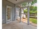 Rear of the house showing the door to the screened in porch. Gas tank nearby at 1552 Harborsun Dr, Charleston, SC 29412