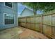 Backyard with wood fence, concrete patio and gravel at 1686 Hunters Run Dr, Mount Pleasant, SC 29464