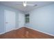 Bedroom with hardwood floors, window, ceiling fan, blue walls and white trim and baseboards at 1686 Hunters Run Dr, Mount Pleasant, SC 29464
