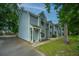 Well-kept townhomes with light blue exterior nestled among green trees at 1686 Hunters Run Dr, Mount Pleasant, SC 29464