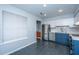 The kitchen features stainless steel appliances, white cabinets, and tile floors, great for cooking and dining at 1686 Hunters Run Dr, Mount Pleasant, SC 29464