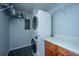 Convenient laundry room features a stacked washer and dryer unit and ample storage at 1686 Hunters Run Dr, Mount Pleasant, SC 29464
