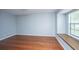 Bright room featuring polished hardwood floors, blue walls, and a window bench at 1686 Hunters Run Dr, Mount Pleasant, SC 29464