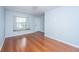 Open living room with hardwood floors, a window bench seat, and blue walls at 1686 Hunters Run Dr, Mount Pleasant, SC 29464