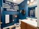 Themed bathroom with sink vanity, Cowboys memorabilia, and good lighting at 1705 Bella Terra Ln, Charleston, SC 29412