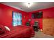 Themed bedroom with arcade, television and red and black bedding at 1705 Bella Terra Ln, Charleston, SC 29412