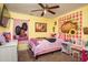A bedroom featuring a bed with colorful decorations and a ceiling fan at 1705 Bella Terra Ln, Charleston, SC 29412