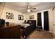 Spacious bedroom featuring modern decor, plush carpet, a ceiling fan, and natural light at 1705 Bella Terra Ln, Charleston, SC 29412