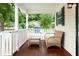 Relaxing front porch with wicker furniture, perfect for enjoying the outdoors at 1705 Bella Terra Ln, Charleston, SC 29412