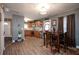 Well-lit kitchen featuring stainless steel appliances, updated cabinets and dining area at 1705 Bella Terra Ln, Charleston, SC 29412