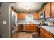Modern kitchen with stainless steel appliances, granite countertops, and custom cabinetry at 1705 Bella Terra Ln, Charleston, SC 29412