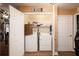 A well-organized laundry closet, complete with a washer, dryer, and storage shelves for supplies and linens at 1705 Bella Terra Ln, Charleston, SC 29412