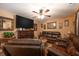 Cozy living room with a fireplace, ceiling fan, and comfortable seating at 1705 Bella Terra Ln, Charleston, SC 29412