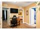 Well-lit home office with wood floors, an expansive desk, and views to the bedroom and bathroom at 1705 Bella Terra Ln, Charleston, SC 29412
