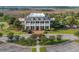Stunning aerial view of the clubhouse with well-maintained grounds and ample parking at 1800 Palmetto Isle Dr, Mount Pleasant, SC 29466