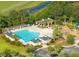 Aerial view of the community pool, playground, and surrounding lush landscape at 1800 Palmetto Isle Dr, Mount Pleasant, SC 29466