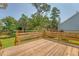 Lovely wooden deck surrounded by lush greenery, offering an inviting outdoor space at 1800 Palmetto Isle Dr, Mount Pleasant, SC 29466