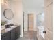 Bathroom showing large tile flooring, vanity, shower, and walk-in closet at 1800 Palmetto Isle Dr, Mount Pleasant, SC 29466