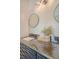 Bathroom vanity features dark counter and accent lighting at 1800 Palmetto Isle Dr, Mount Pleasant, SC 29466