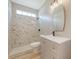 Bathroom features white marble shower and updated sink vanity at 1800 Palmetto Isle Dr, Mount Pleasant, SC 29466