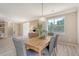 Elegant dining room with a stylish table, modern lighting, and ample space for entertaining guests at 1800 Palmetto Isle Dr, Mount Pleasant, SC 29466
