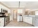 Bright and spacious kitchen with white cabinets, stainless steel appliances, and modern lighting fixtures at 1800 Palmetto Isle Dr, Mount Pleasant, SC 29466