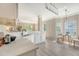Modern open kitchen with white countertops, stainless steel appliances, and a seamless flow to the living area at 1800 Palmetto Isle Dr, Mount Pleasant, SC 29466