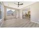 Bright living room with large windows and open concept leading to the kitchen at 1800 Palmetto Isle Dr, Mount Pleasant, SC 29466