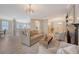 Open-concept living room with a view of the kitchen, dining area, and front entrance at 1800 Palmetto Isle Dr, Mount Pleasant, SC 29466