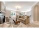 Bright and airy living room with a fireplace and an open layout to the dining area at 1800 Palmetto Isle Dr, Mount Pleasant, SC 29466