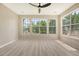 Living room with many windows, flooding the area with natural light at 1800 Palmetto Isle Dr, Mount Pleasant, SC 29466
