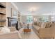 Inviting living room with a fireplace, sofa, and large windows offering ample natural light at 1800 Palmetto Isle Dr, Mount Pleasant, SC 29466