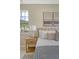 Close up of main bedroom shows a side table, window, and comfortable bed at 1800 Palmetto Isle Dr, Mount Pleasant, SC 29466