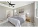 Bright main bedroom with comfortable bed, side tables, and view to exterior at 1800 Palmetto Isle Dr, Mount Pleasant, SC 29466