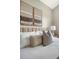 Close up of main bedroom shows decorative pillows on bed and wall art at 1800 Palmetto Isle Dr, Mount Pleasant, SC 29466