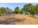 Community playground featuring modern climbing structures and slides set in a safe, wood chip-covered area at 1800 Palmetto Isle Dr, Mount Pleasant, SC 29466