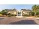 Elegant pool entry with pergola, accented by symmetrical architecture and lush, manicured landscaping at 1800 Palmetto Isle Dr, Mount Pleasant, SC 29466