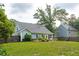 Large backyard with a lush lawn, mature trees, and plenty of space for recreation and entertaining at 1928 Gasque St, Johns Island, SC 29455