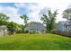 Expansive backyard featuring a lush lawn, mature trees, and tidy landscaping, perfect for outdoor activities at 1928 Gasque St, Johns Island, SC 29455