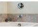 Close up shot of bathroom faucet with coordinating tile surround at 1928 Gasque St, Johns Island, SC 29455