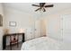Bright bedroom featuring a ceiling fan, desk, chair, and neutral tones at 1928 Gasque St, Johns Island, SC 29455