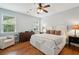Serene bedroom with hardwood floors, a ceiling fan, and natural light at 1928 Gasque St, Johns Island, SC 29455